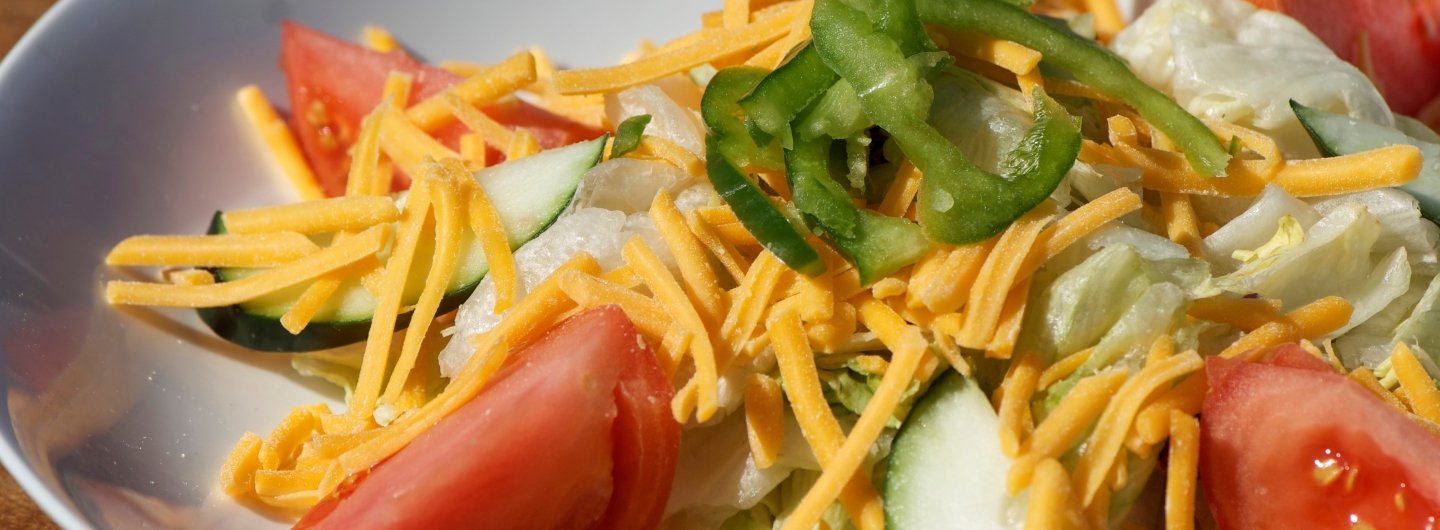 tossed salad with cheese and tomatoes
